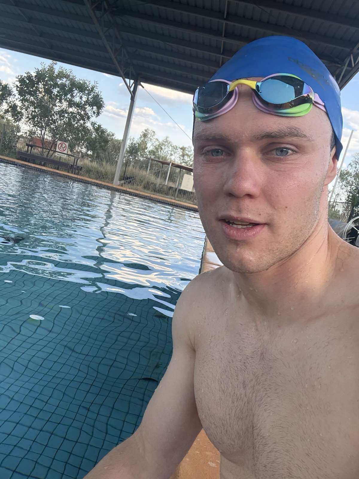 Charlie swimming in a remote community pool