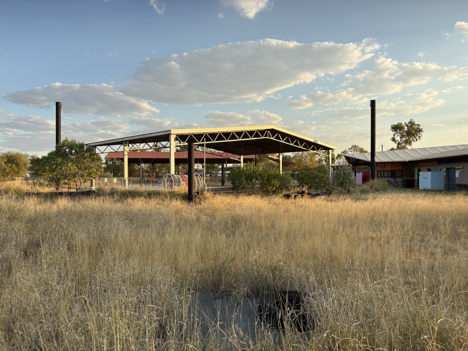 A remote community pool at dusk